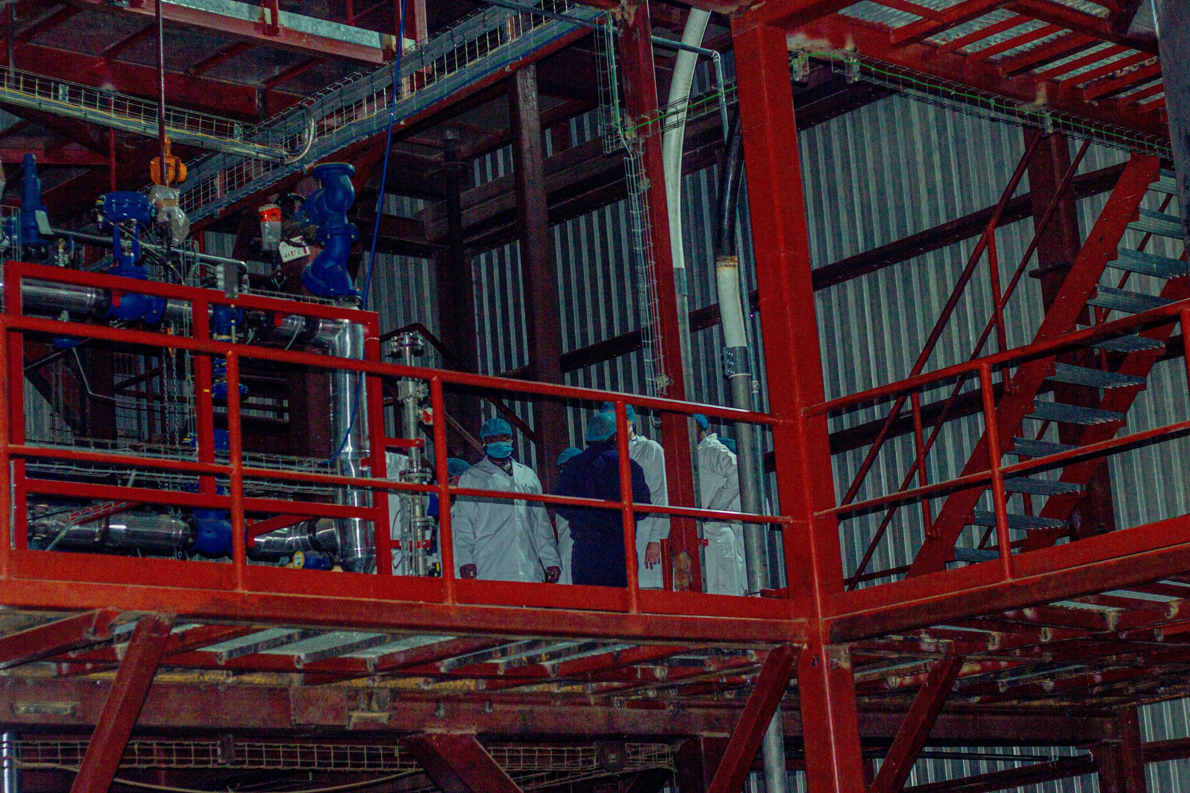 Factory engineers discussing operations